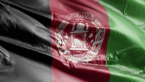 la bandera de afganistán se agita lentamente en el bucle del viento. la bandera afgana se balancea suavemente en la brisa. el fondo de relleno completo. 20 segundos de bucle.