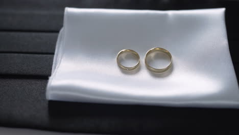 close-up of two gold wedding rings