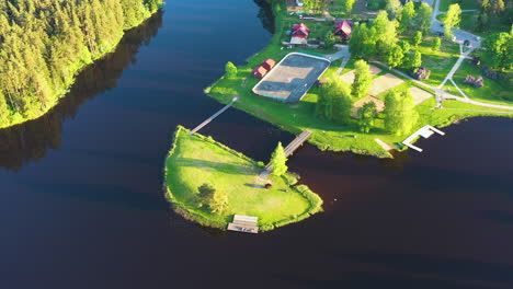 aerial top down of tepera ezera beach on island with river during sunset