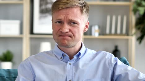businessman upset by loss while working in office
