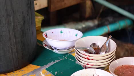 stacked bowls and chopsticks on a table