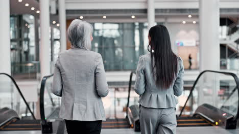 back, escalator and a manager talking to