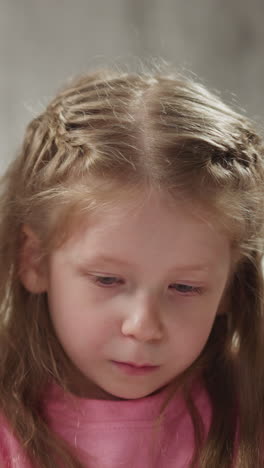 smiling african-american teacher helps cute little girl do english language homework at private tuition with native speaker closeup slow motion