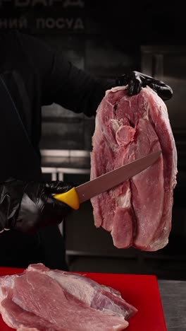 chef preparing raw pork loin