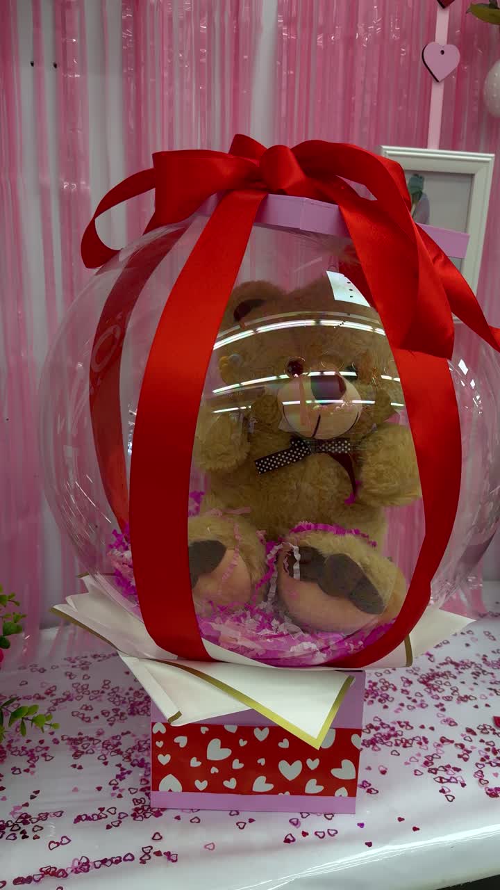 Teddy bear in bubble wrap as Valentine's Day gift, wrapped with love