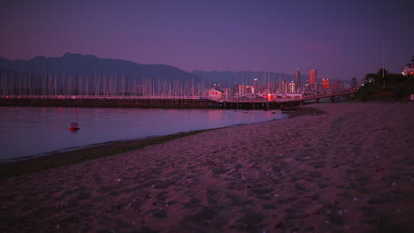 Late-evening-at-Jericho-beach-Sailing-Centre-Vancouver,-Pacific-ocean,-ships,-boats,-Cross-Mountain-and-Vancouver-Downton-in-the-background