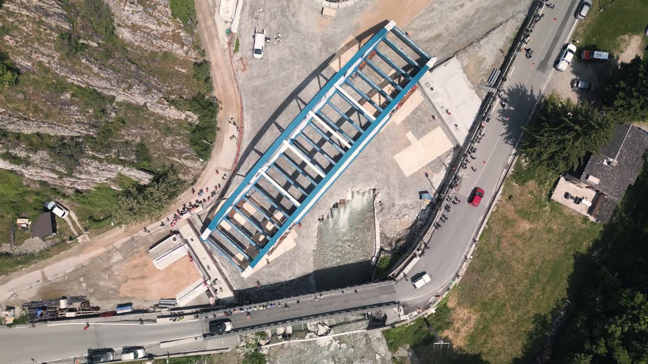 Aerial View of a New Bridge Construction Project in a Mountain Valley