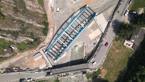 aerial view of a new bridge construction project in a mountain valley