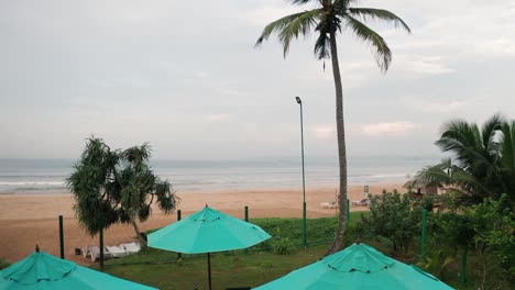 Young-woman-in-infinity-pool-enjoying-luxury-lifestyle-at-hotel-spa-with-view-of-a-beach