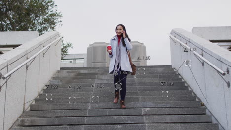 animation of financial data processing over biracial woman using smartphone in city