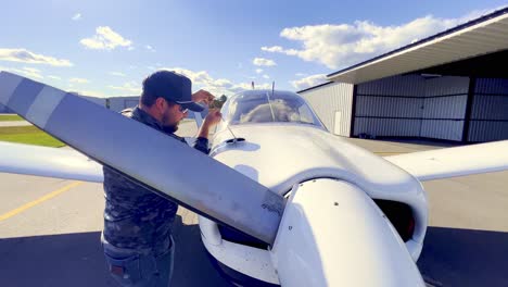 oil-checked-during-preflight-inspection-of-piper-cherokee-180-by-private-pilot-prior-to-flight
