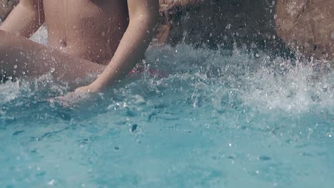 girl-with-perfect-body-sits-under-waterfall-slow-motion