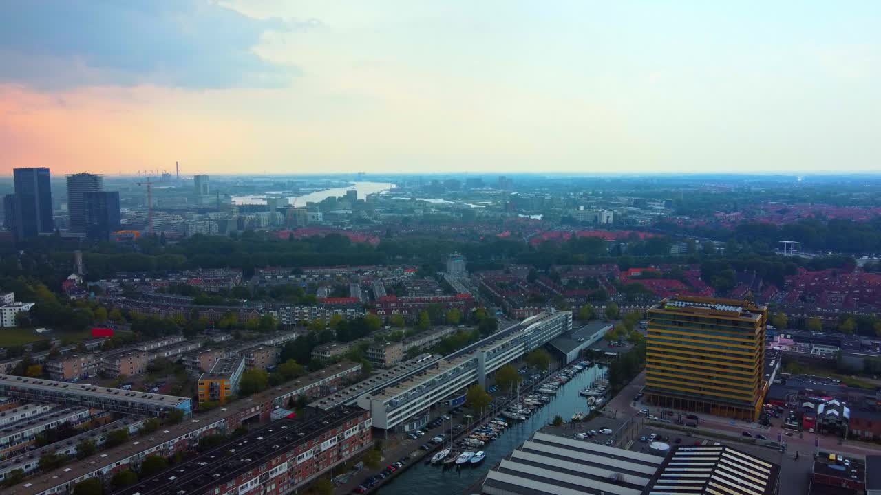 Aerial View Of Amsterdam-Noord Cityscape At Sunset In North Holland, Netherlands. IJ River In Background.