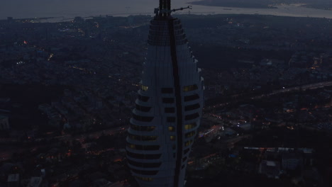 Spectacular-View-of-Skyscraper-Building,-Istanbul-TV-Tower-on-Hill,-Turkey-at-Dusk,-Aerial-Drone-Shot