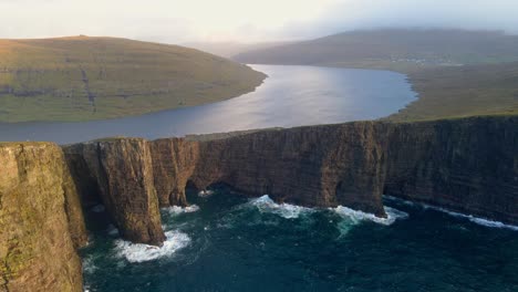 Medium-range-drone-footage-of-the-Leitisvatn-Lake,-aka-the-Floating-Lake,-on-the-Vagar-island-in-the-Faroe-Islands