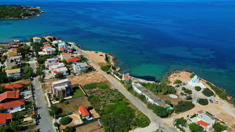 Aerial-Panoramic-at-Coastal-town,-Travel-destination-in-Greek-blue-ocean-beach