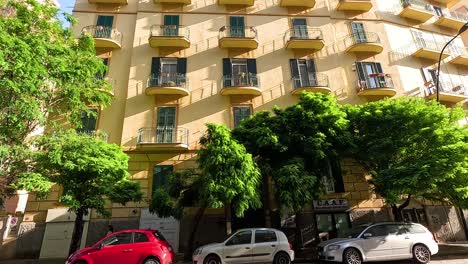 street view of a building with cars