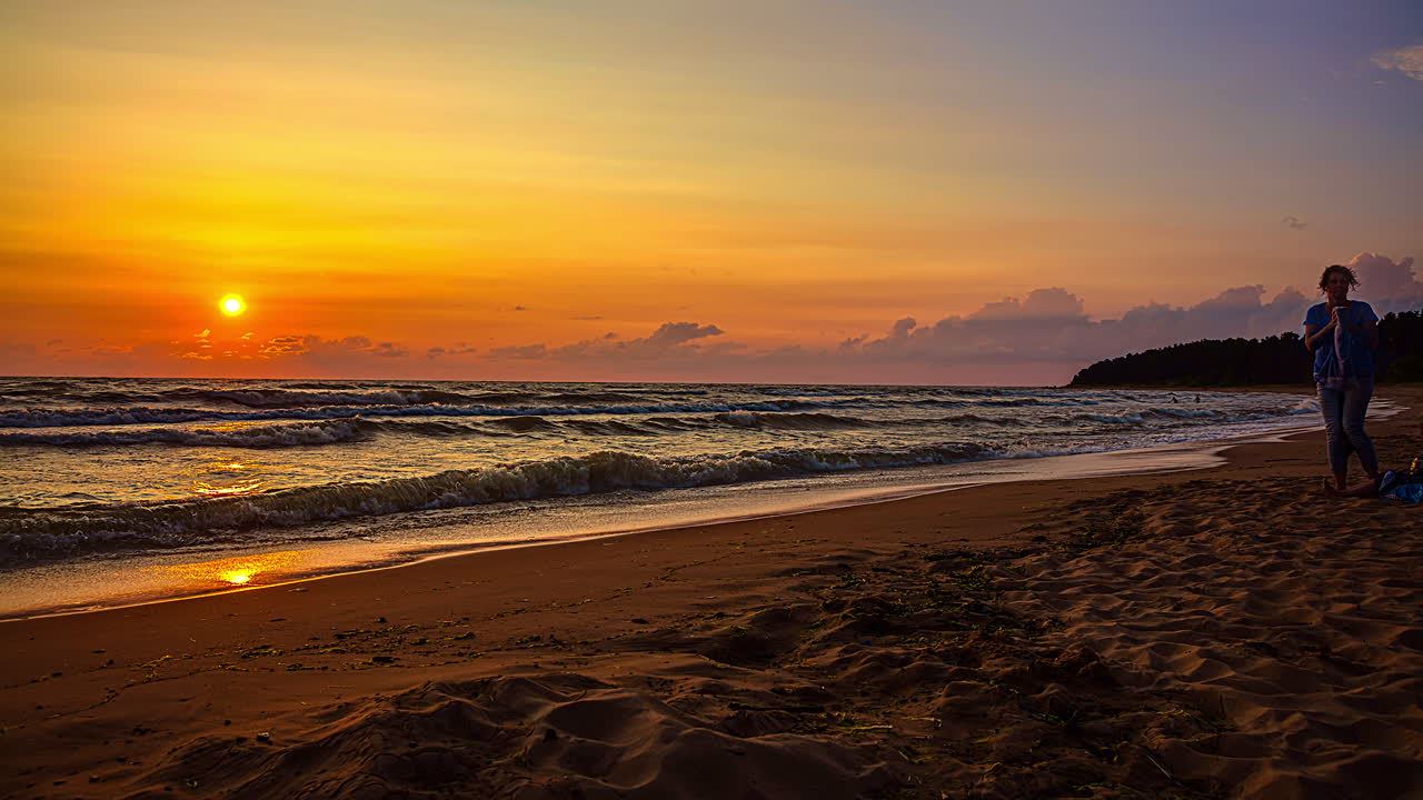 idyllic sunset timelapse over beach in Cape Kolka, Baltic Sea, in Livonian coast, Latvia