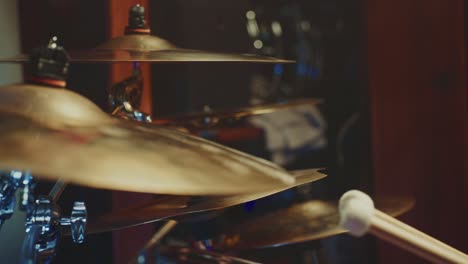 close-up view of a drummer playing a drum set
