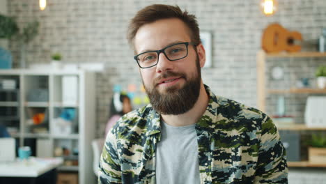 man in a camouflage shirt in office