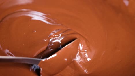 smooth chocolate being stirred and poured