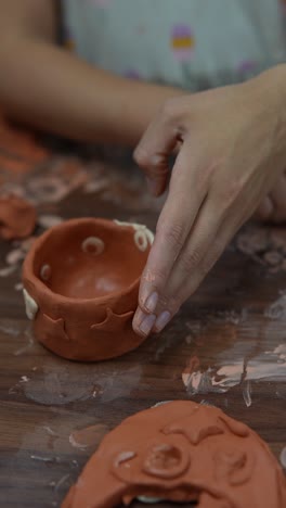 children making clay pots