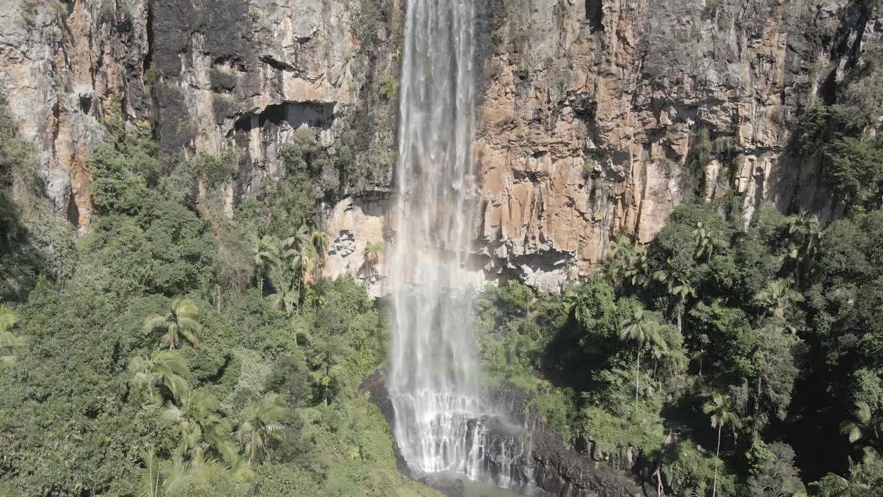 Aerial View of Stunning Waterfall Cascading Down a Cliff Face
