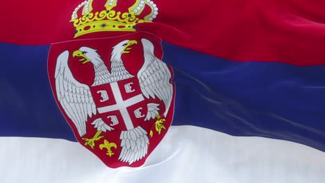 full screen serbian flag is waving slowly