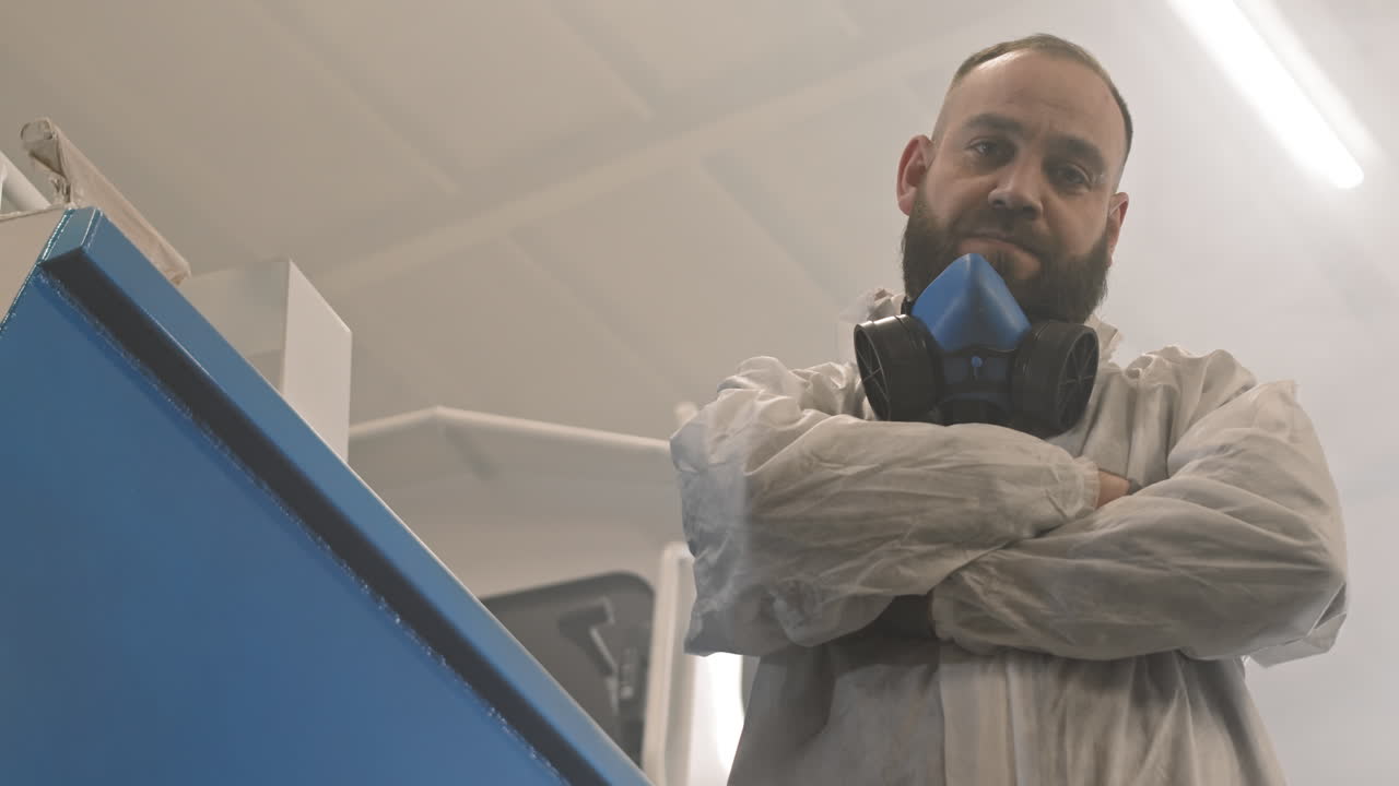 Man in Protective Suit with Respirator