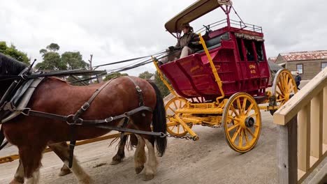 historic horse-drawn carriage moving through sovereign hill