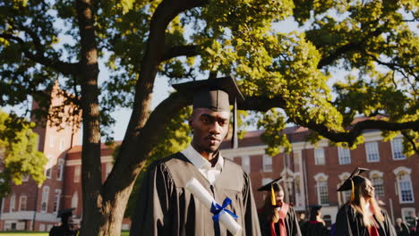 young black man graduates from university