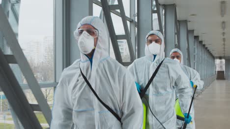 cleaning and disinfection workers in protective gear