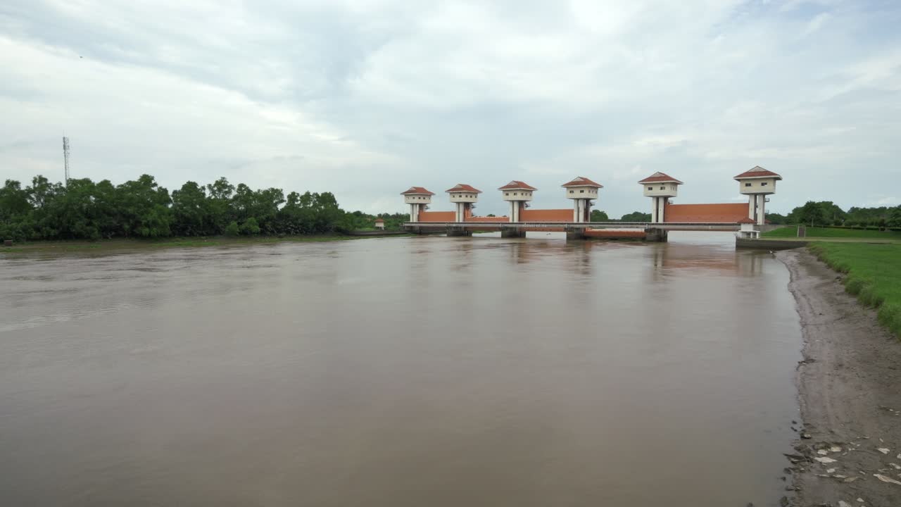 Explore a stunning aerial view of a river regulation structure enhancing the natural landscape and managing water flow efficiently