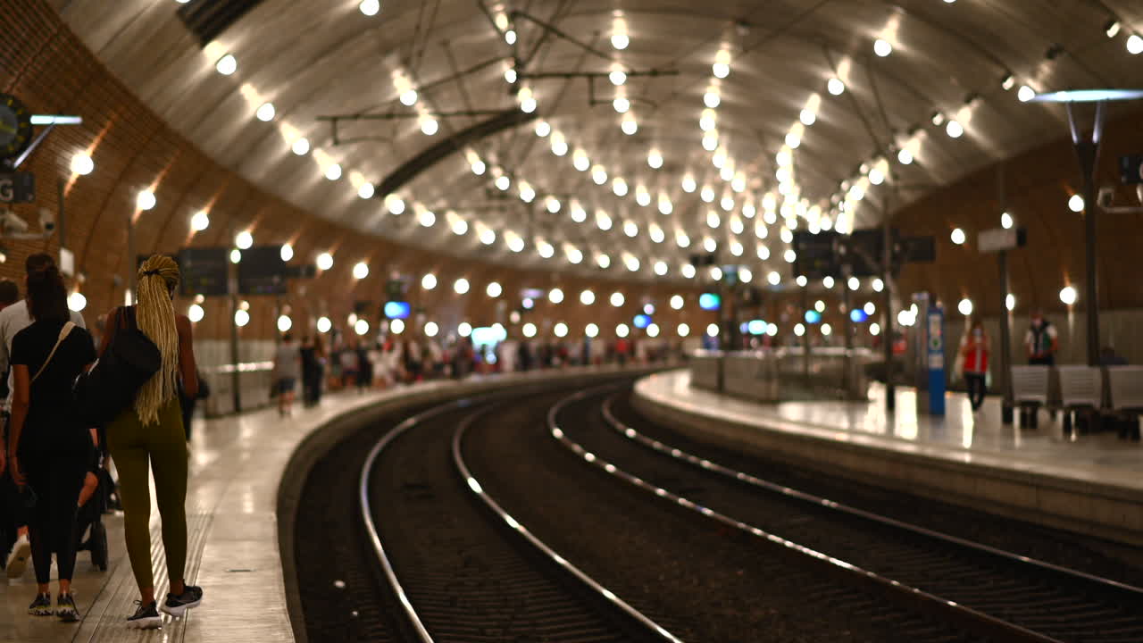 People at the Monte Carlo train station in Monaco