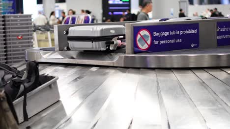 airport baggage carousel with luggage