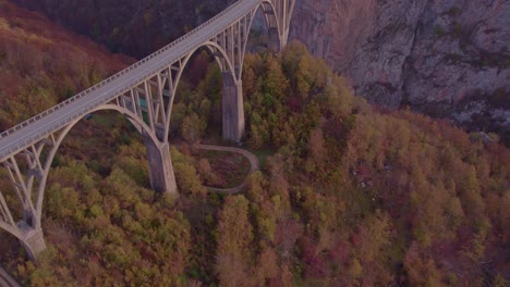 Iconic-landmark-concrete-Tara-Bridge-crossing-steep-river-canyon,-Montenegro