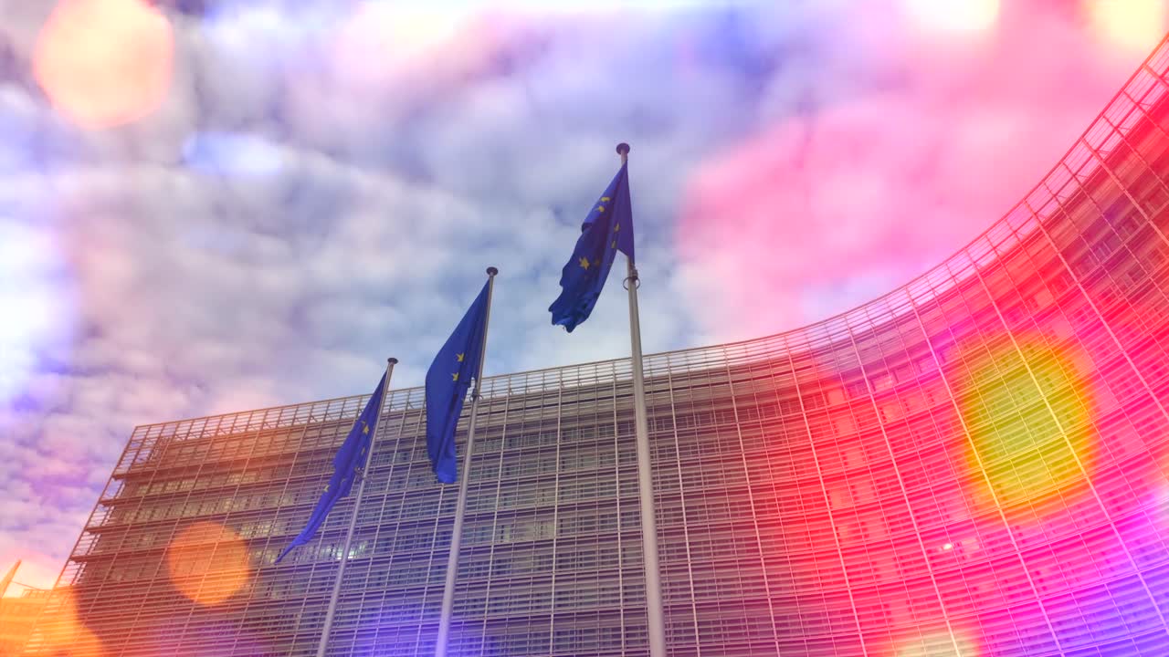 Bokeh light effects over waving European Union flags in slow motion
