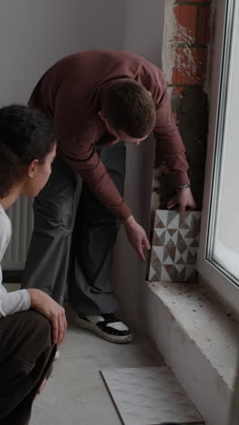 couple choosing tiles for home renovation
