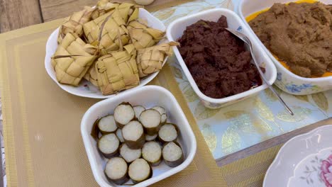 malaysian local traditional food, lemang, ketupat, ketupat palas and other eat during eid mubarak or known as hari raya aidilfitri celebration