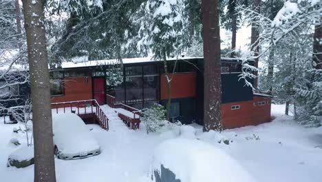 snowy foreground with house and car densely covered with snow in tacoma, washington state
