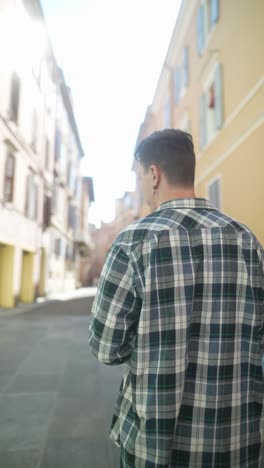 man walking down a city street