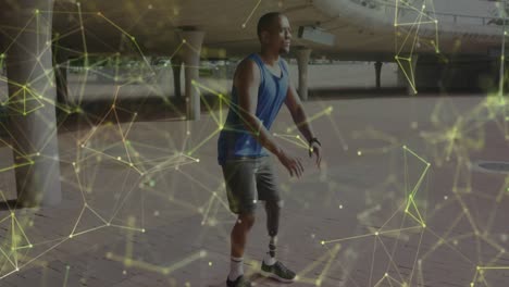 animation of yellow communication network over male athlete with prosthetic leg exercising outdoors