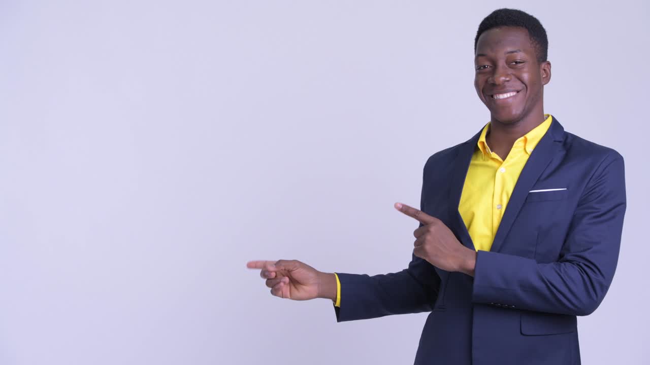 Young handsome African businessman in suit