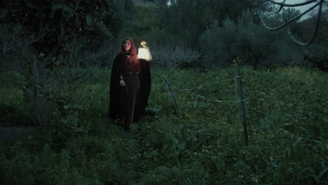 enigmatic woman walks in the meadow at night bewitched forest