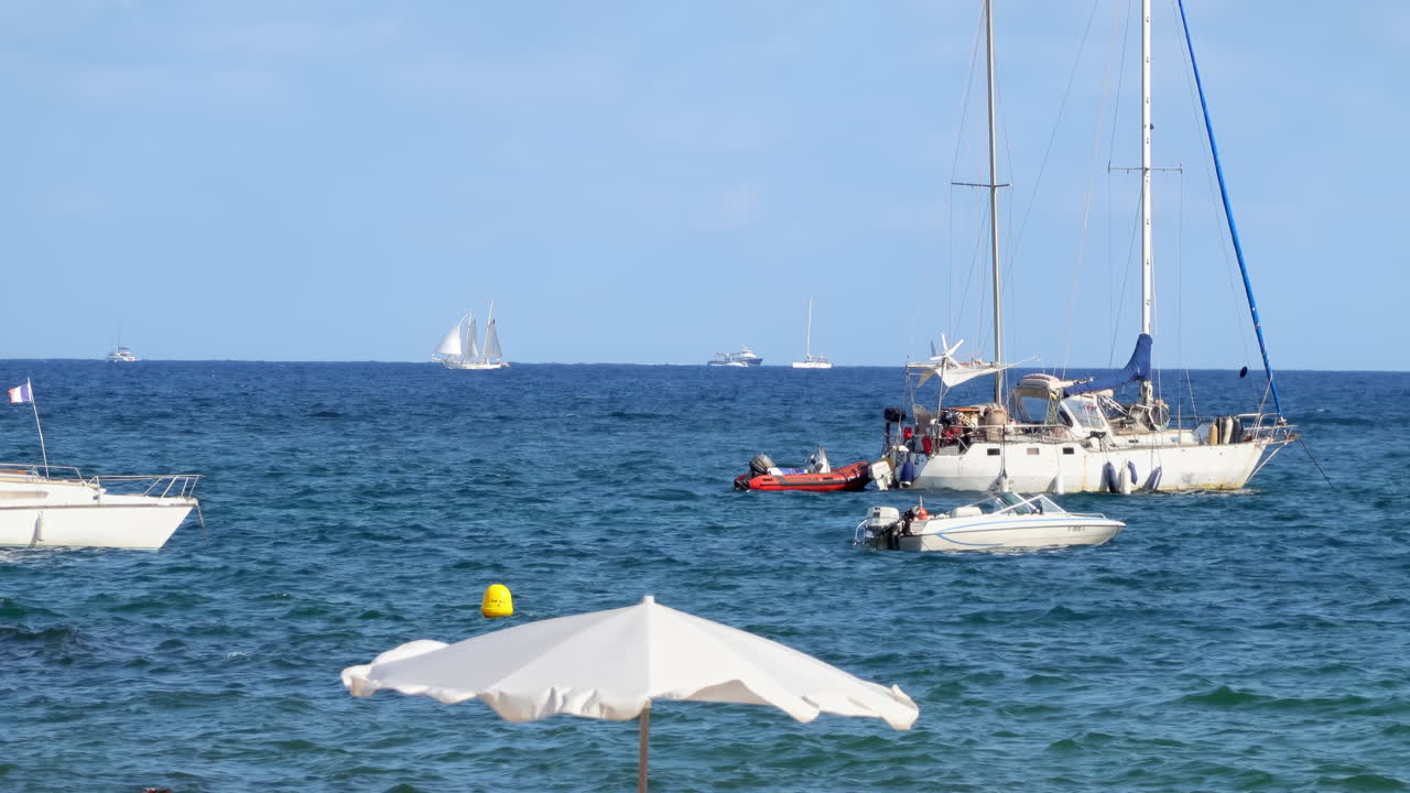 Boats moving on the sea in Golfe-Juan, France in daylight