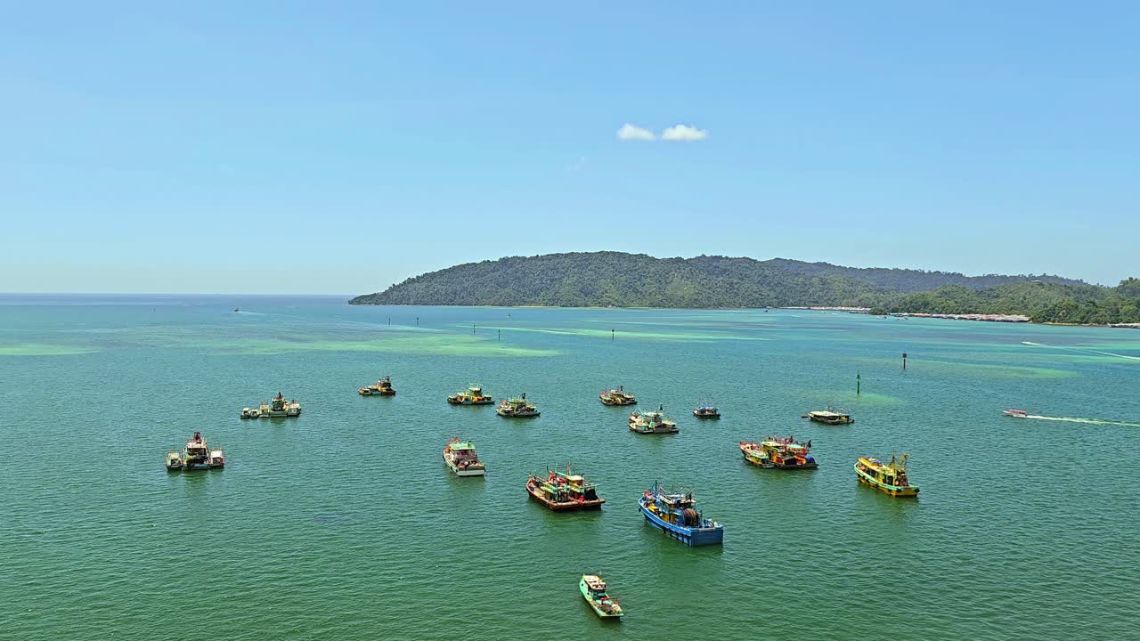 Colorful Malaysian Fishing Boats At The Bay Near Kota Kinabalu In Borneo, Malaysia. Aerial Wide Shot
