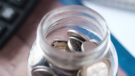 saving money in a glass jar