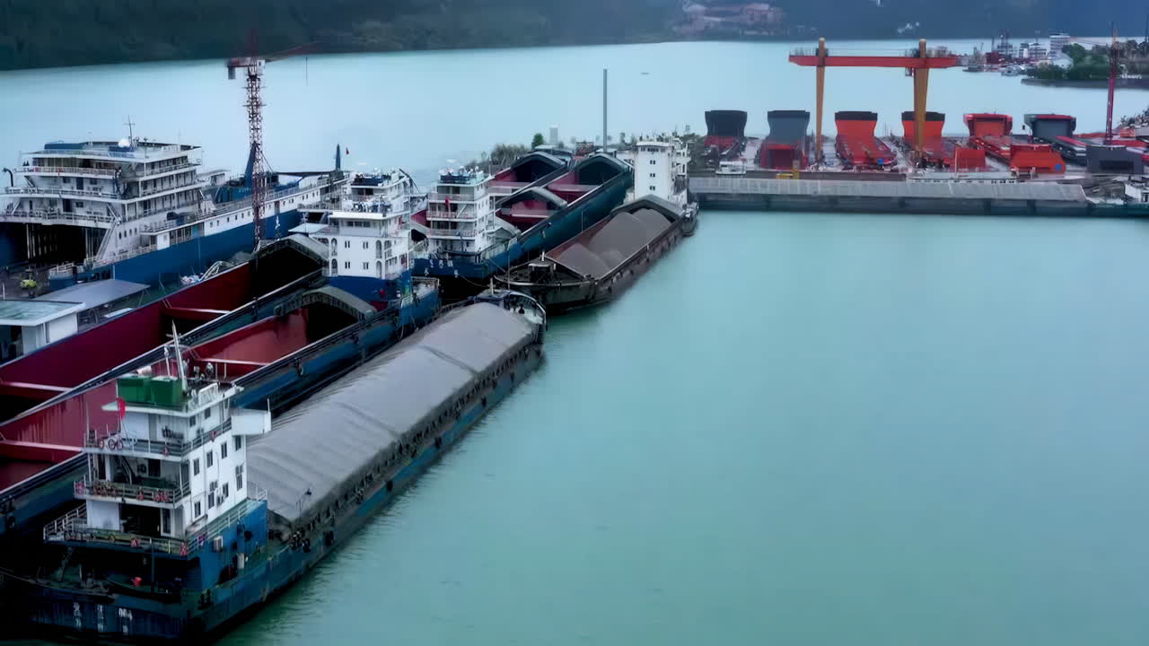 Aerial View of Barges and Ships at a River Port