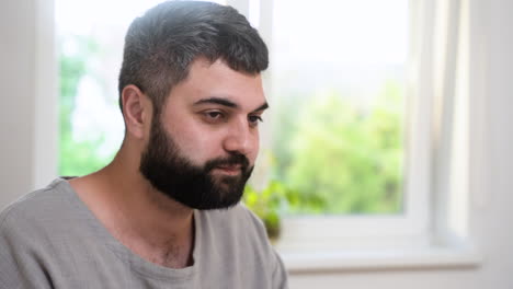 close-up view of islamic manwith grey hair.