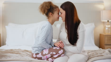 bedroom, nose together and mother with child